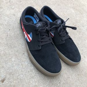 Nike Sb black suede brown bottom shoes.